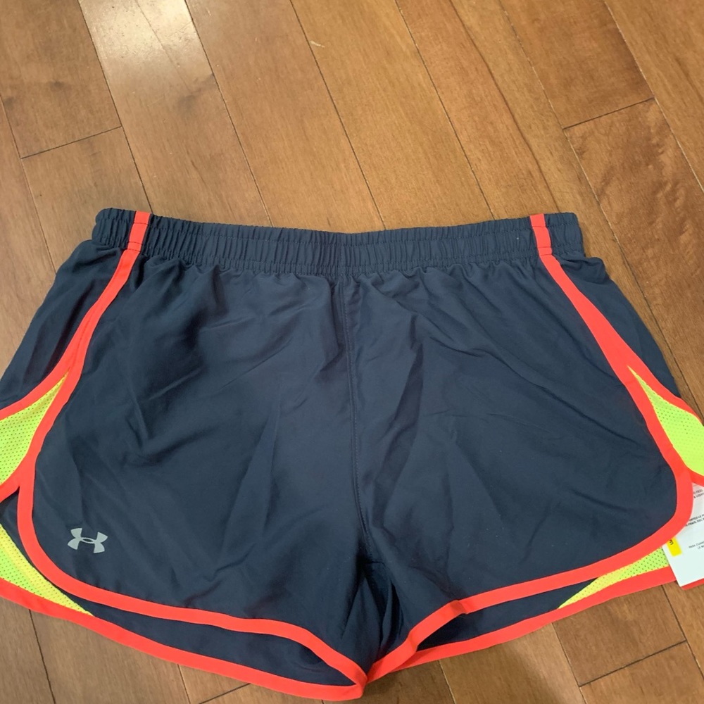 BWT Under Armour Dri Fit athletic shorts for women. Size M. Brand new with tags